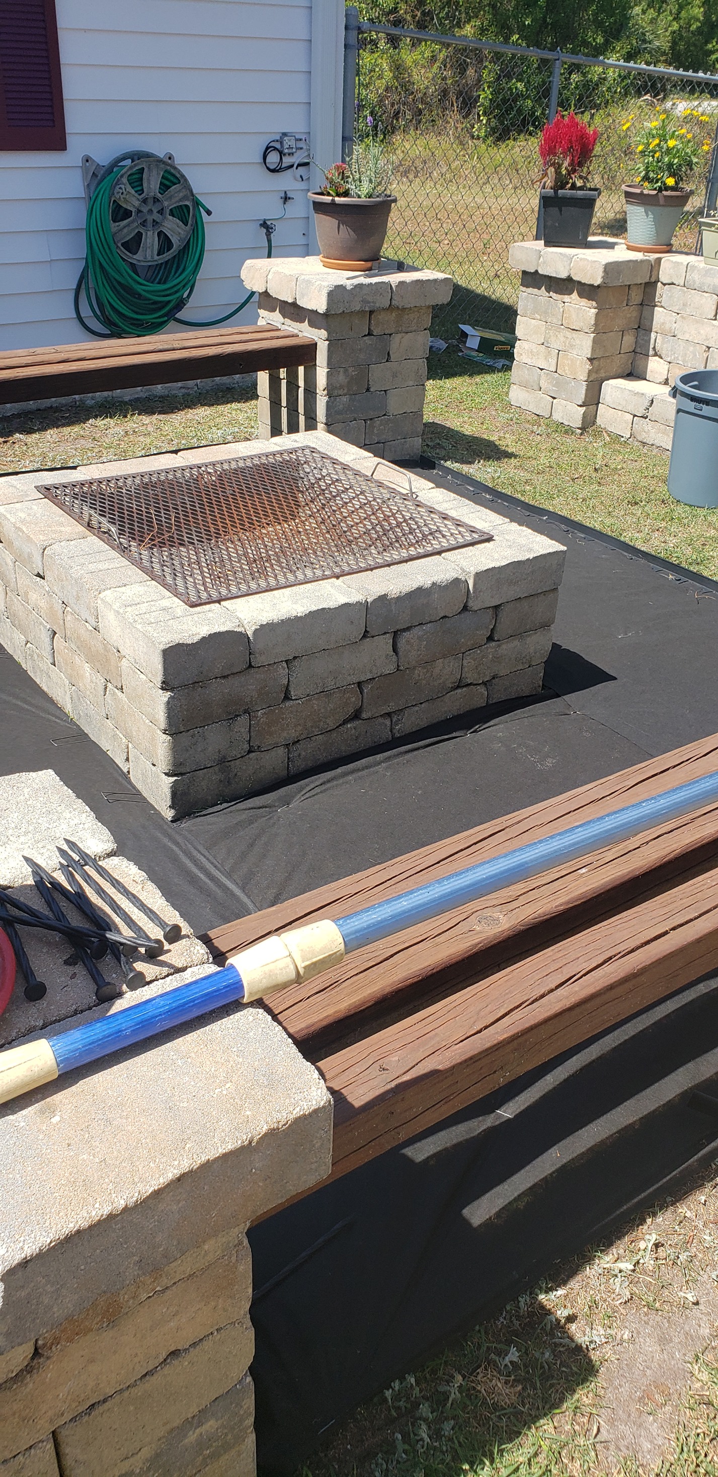 A fire pit sitting on top of a cement slab