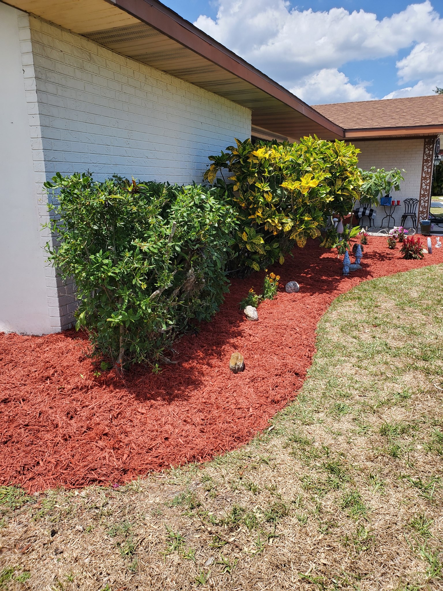 A house with red mulch in front of it